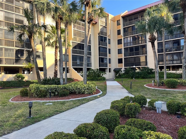 view of property's community with a yard