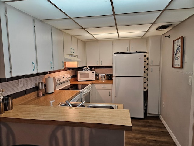 kitchen with white cabinetry, white appliances, and a paneled ceiling