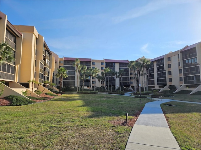 view of home's community featuring a yard