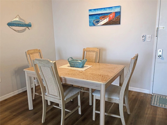 dining space featuring dark hardwood / wood-style flooring