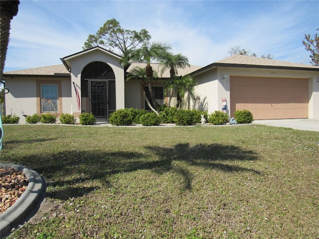 ranch-style house with a garage and a front lawn