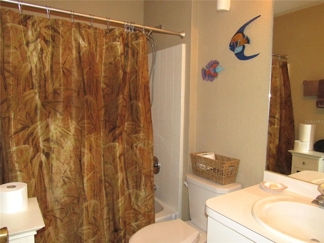 full bathroom featuring vanity, toilet, and shower / tub combo