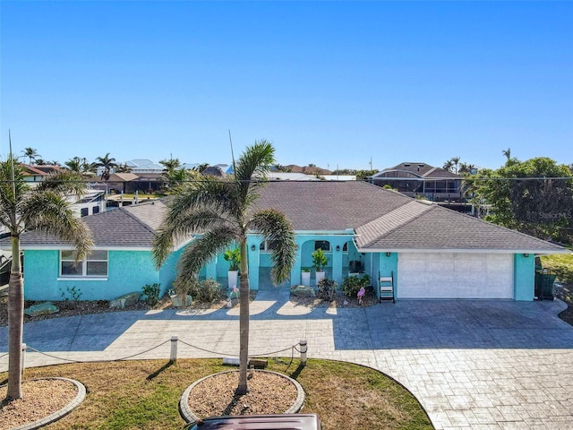 view of front of house with a garage and a front yard