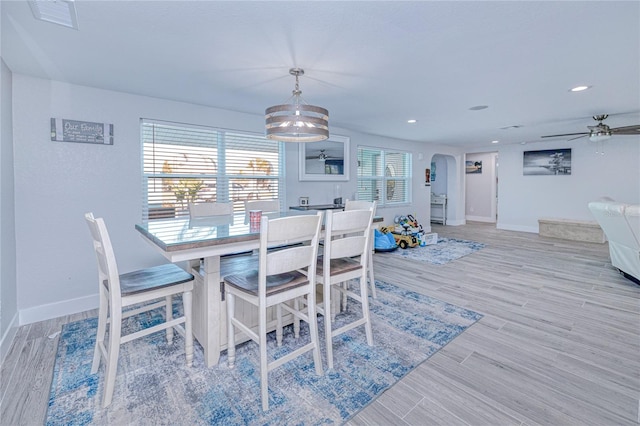 dining space featuring ceiling fan and light hardwood / wood-style flooring