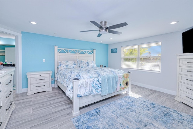 bedroom with ceiling fan and light hardwood / wood-style flooring