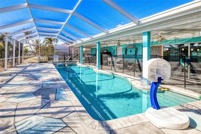 view of pool featuring a patio area and glass enclosure