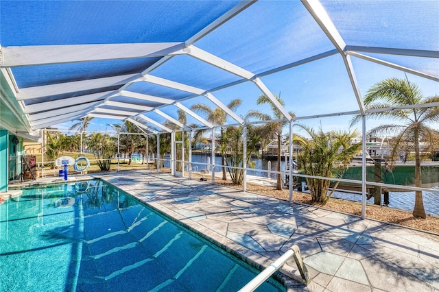 view of swimming pool featuring a water view, a lanai, and a patio