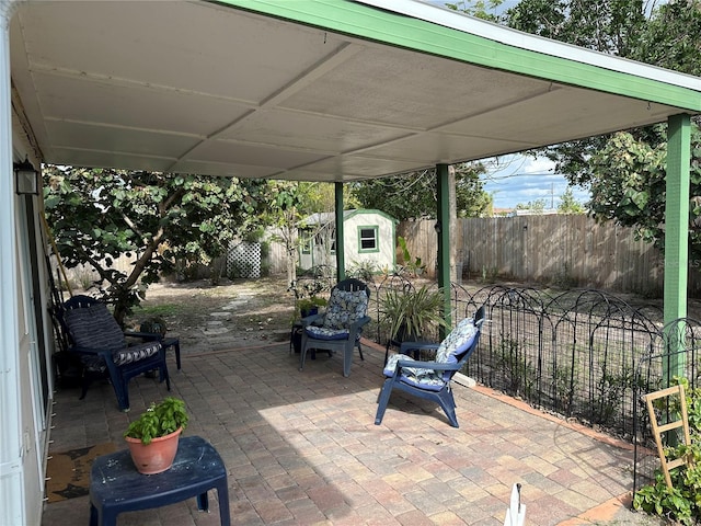 view of patio featuring a storage unit