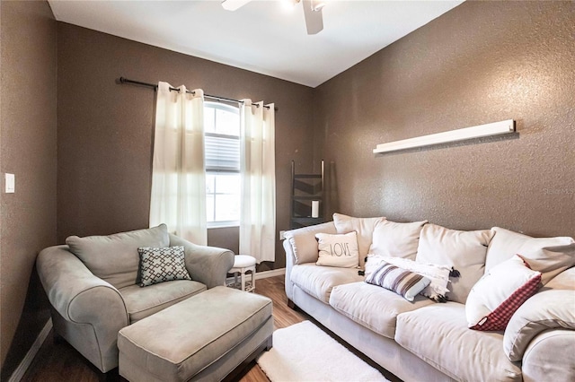 living room featuring ceiling fan and wood-type flooring