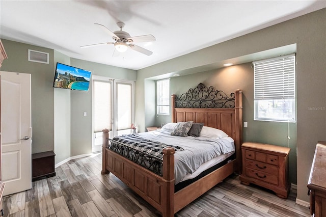 bedroom with hardwood / wood-style floors and ceiling fan