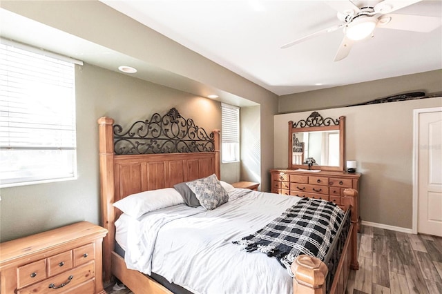 bedroom with wood-type flooring and ceiling fan