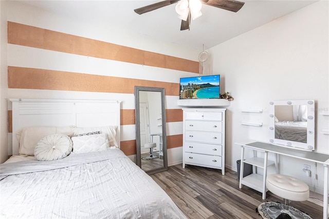 bedroom featuring hardwood / wood-style flooring and ceiling fan