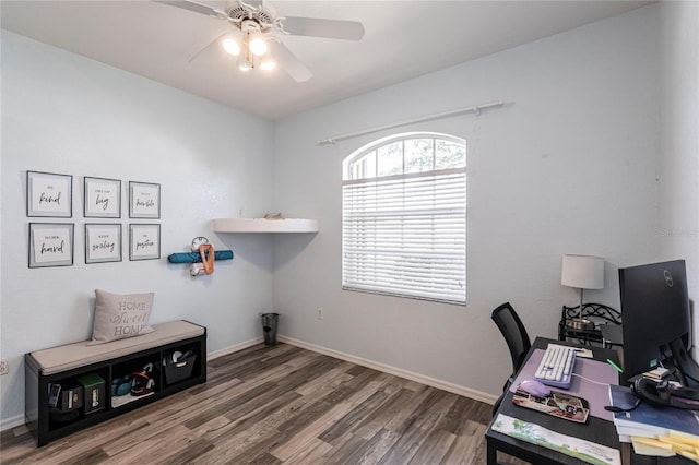 office space with dark wood-type flooring and ceiling fan