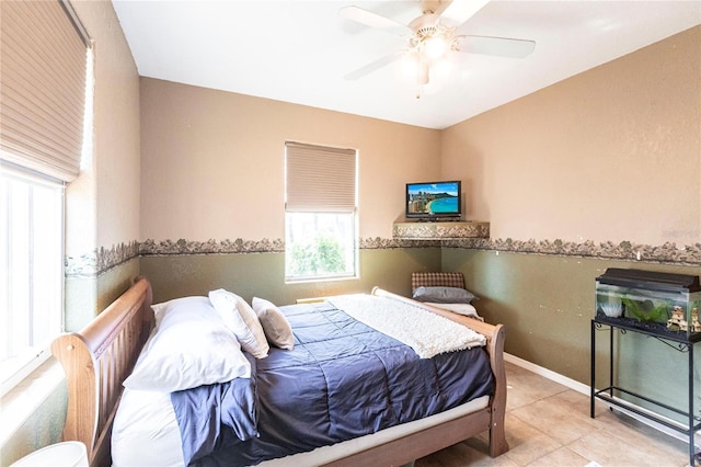 tiled bedroom with ceiling fan