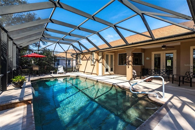 view of pool featuring ceiling fan, a lanai, and a patio