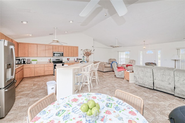 dining area with lofted ceiling and ceiling fan