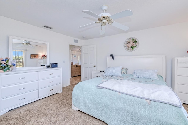 bedroom with light carpet and ceiling fan