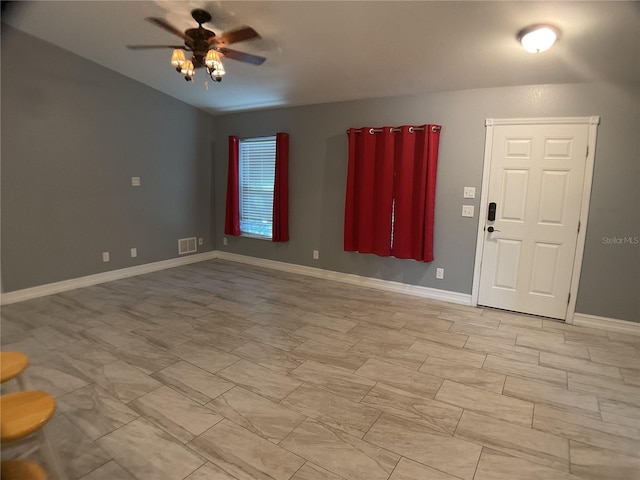 interior space featuring vaulted ceiling and ceiling fan