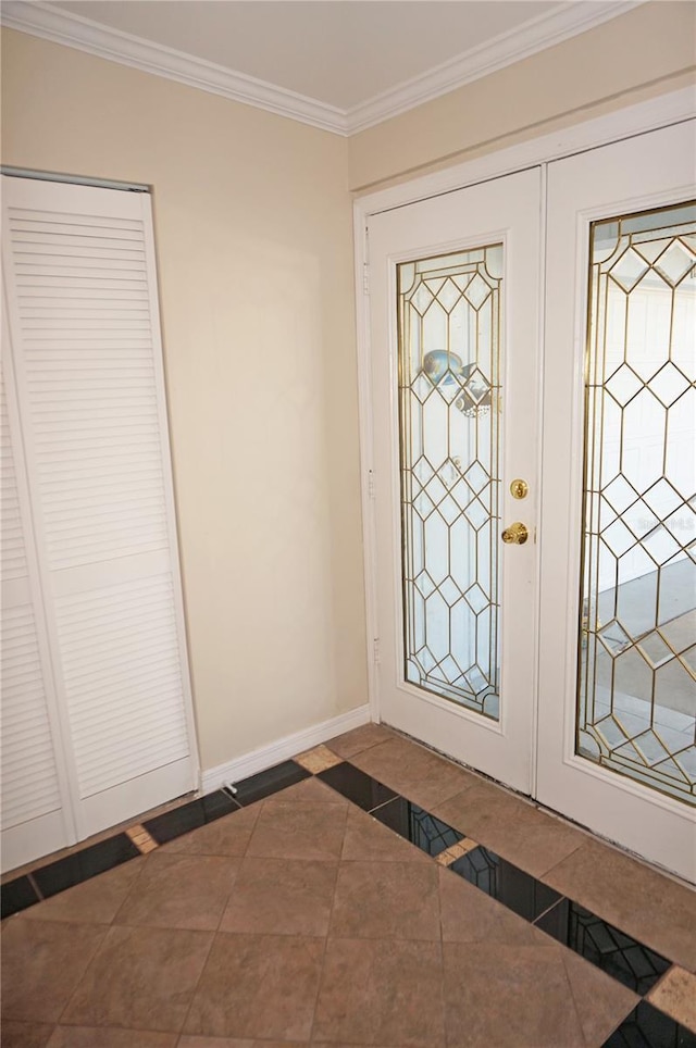 tiled entrance foyer with ornamental molding