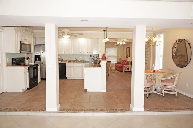 kitchen with light tile patterned floors, crown molding, ceiling fan with notable chandelier, black appliances, and decorative light fixtures