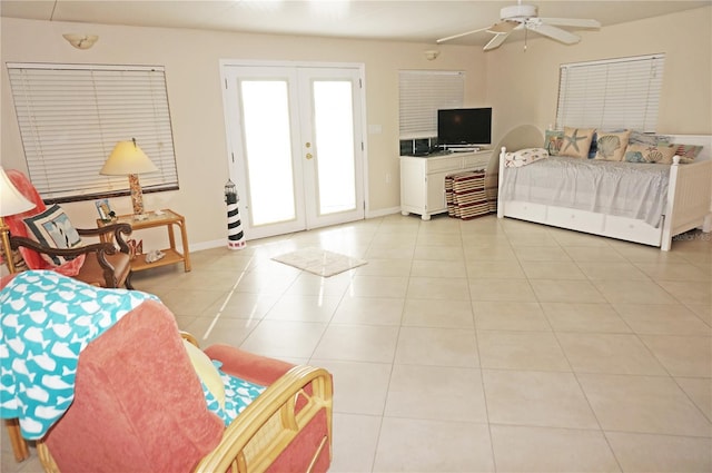 tiled bedroom featuring access to exterior, french doors, and ceiling fan