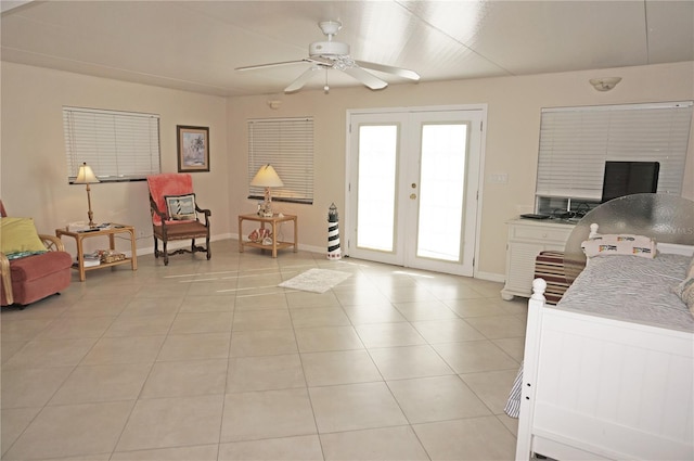 interior space with french doors and ceiling fan