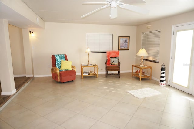 sitting room featuring ceiling fan and light tile patterned floors