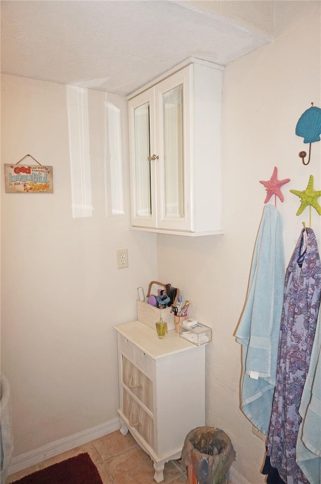 bathroom with tile patterned floors