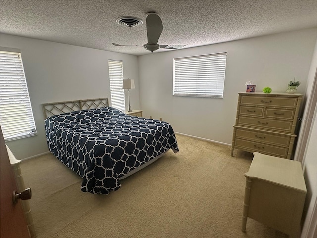 432 Olivia Rd, Venice, FL 34293 - carpeted bedroom featuring a textured ceiling and ceiling fan