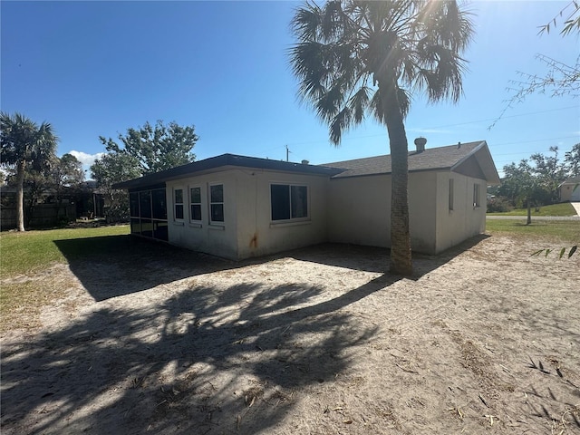 432 Olivia Rd, Venice, FL 34293 - rear view of house featuring a sunroom