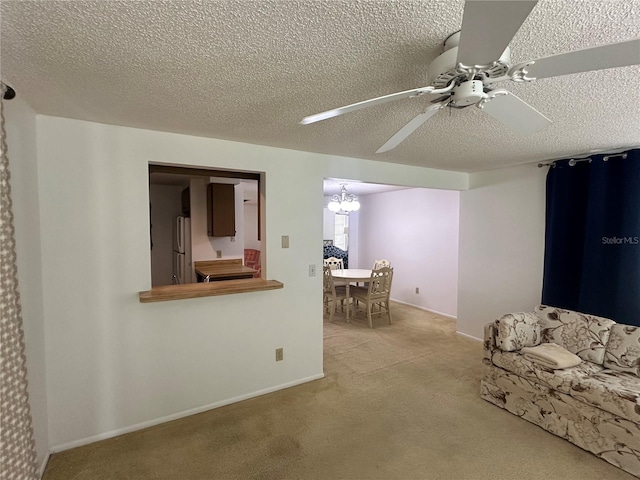 432 Olivia Rd, Venice, FL 34293 - living area featuring carpet floors, ceiling fan, a chandelier, and a textured ceiling