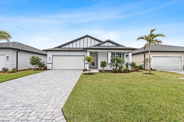 ranch-style home featuring a garage and a front yard