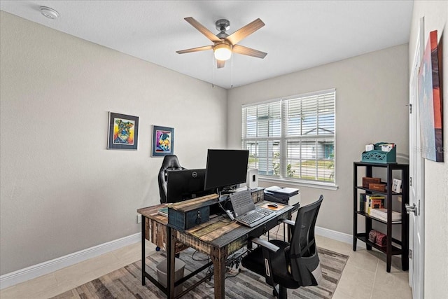 tiled office space featuring ceiling fan