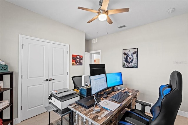 office space with light tile patterned flooring and ceiling fan