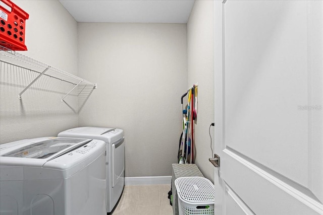 clothes washing area featuring washing machine and clothes dryer