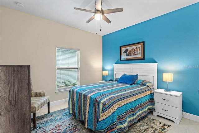 tiled bedroom with ceiling fan