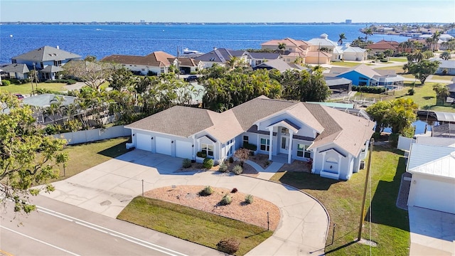 drone / aerial view with a water view