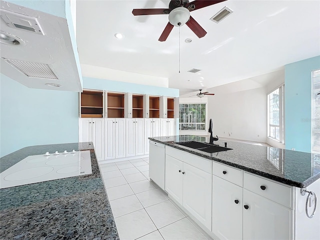 kitchen with extractor fan, sink, a center island with sink, white appliances, and white cabinets