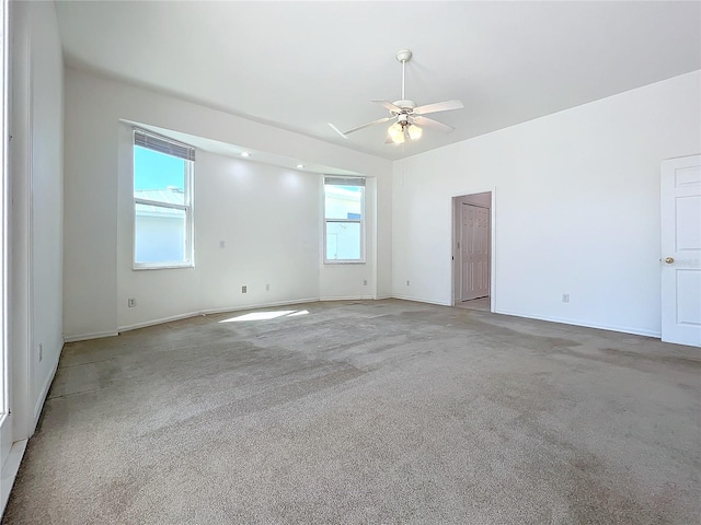 carpeted empty room with ceiling fan