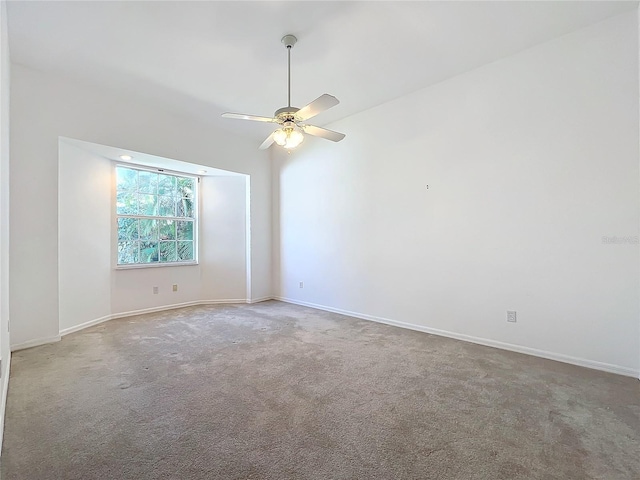 spare room with carpet floors and ceiling fan