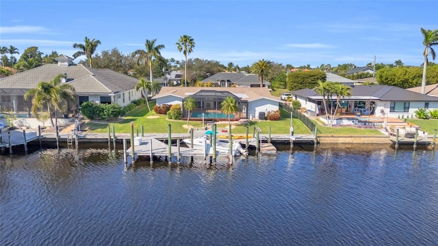 view of dock featuring a water view and a lawn