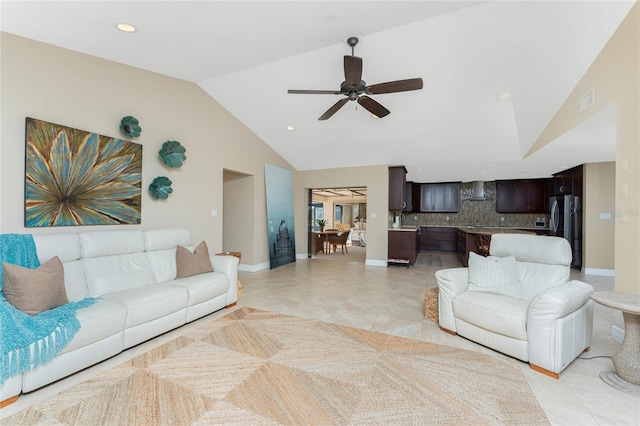 living room with light tile patterned floors, high vaulted ceiling, and ceiling fan