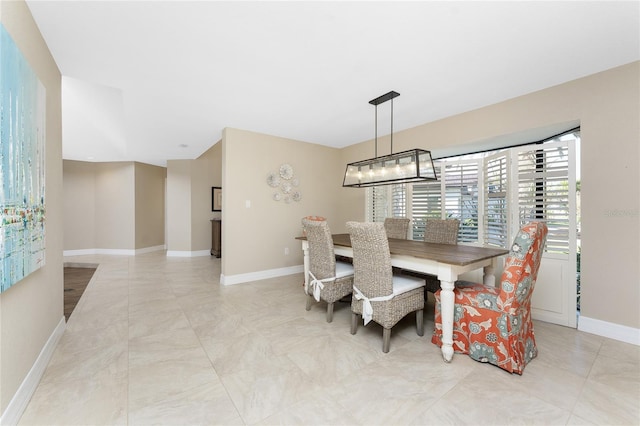 dining area featuring a chandelier