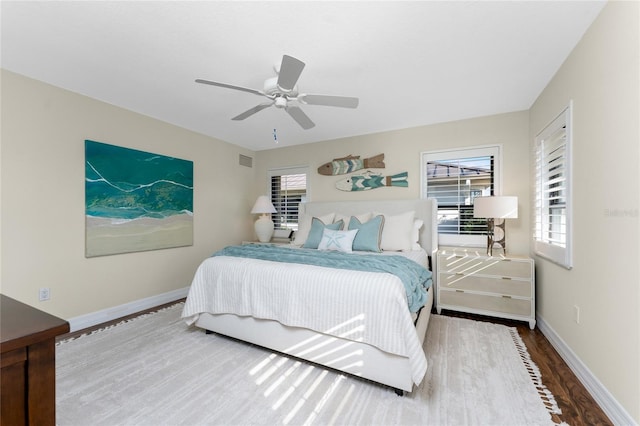 bedroom with wood-type flooring and ceiling fan