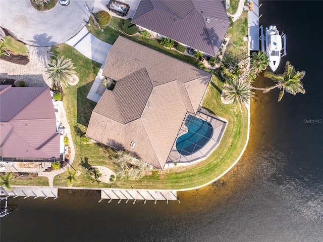 birds eye view of property featuring a water view