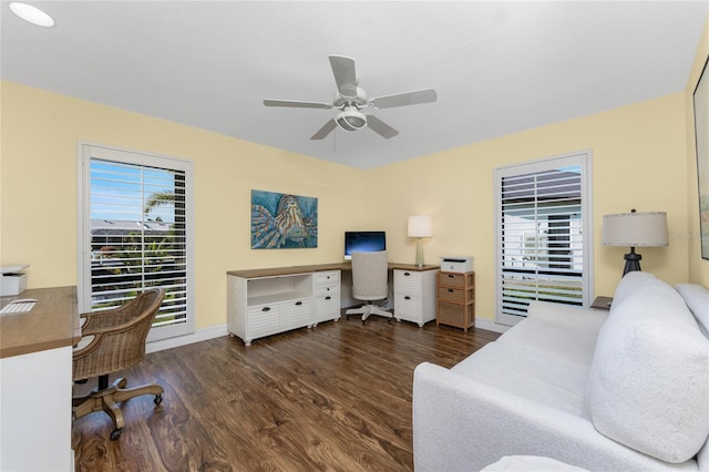 office space with dark hardwood / wood-style flooring, plenty of natural light, and ceiling fan