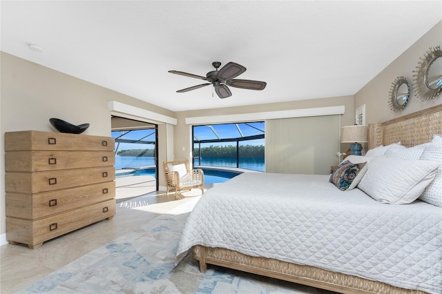 bedroom featuring access to exterior, ceiling fan, and a water view