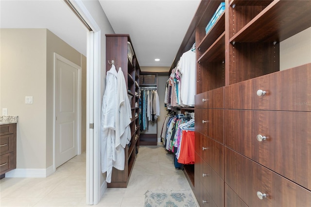 spacious closet featuring light tile patterned floors