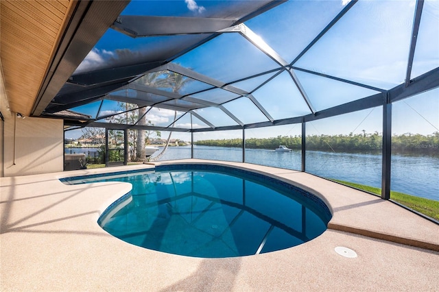 view of swimming pool with a water view, a patio, and glass enclosure