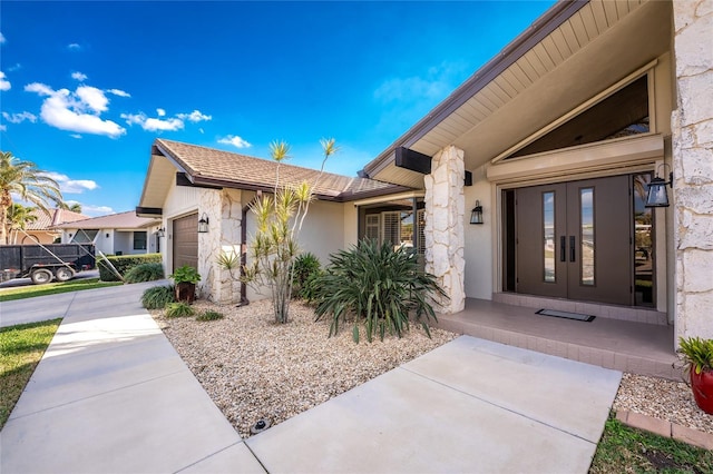 entrance to property featuring a garage